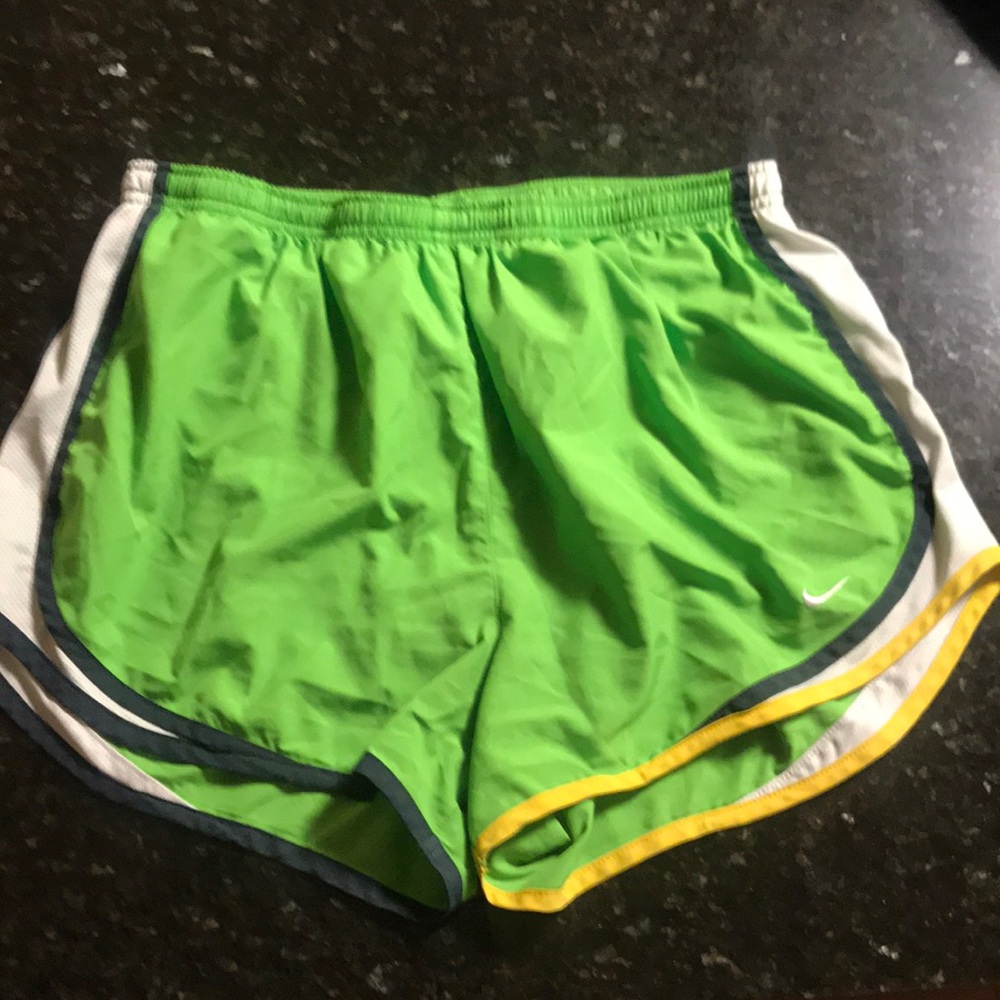 Green Nike running shorts